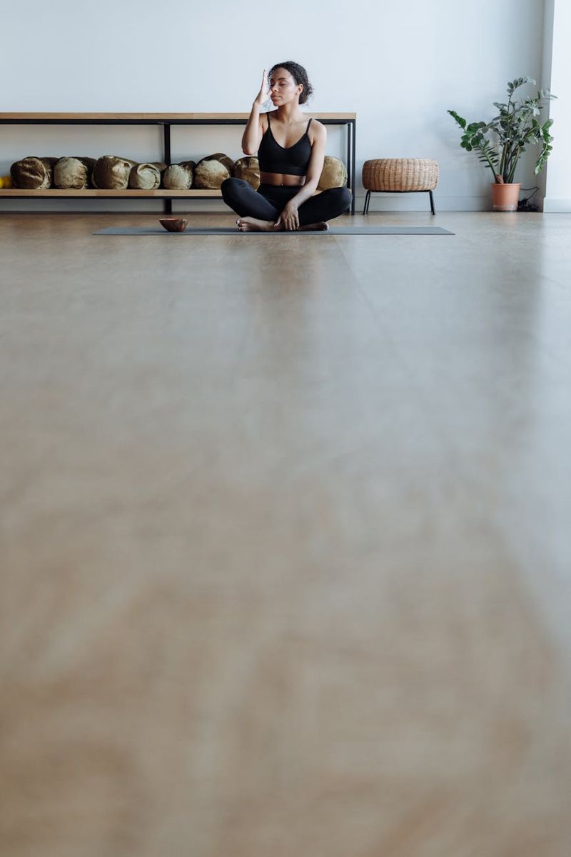 Person practicing yoga in a bright minimal studio space